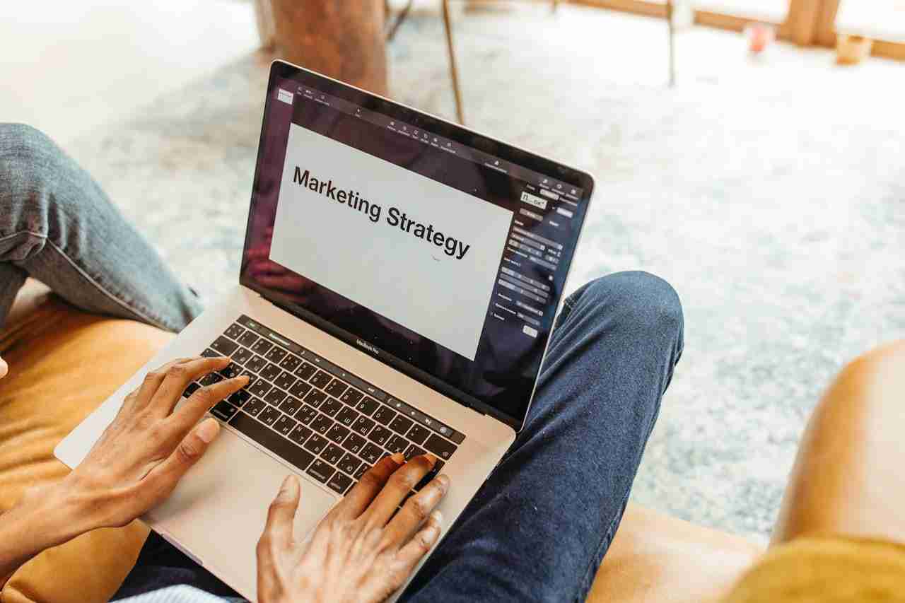 Small business owner checking website performance on a laptop and digital marketing strategies